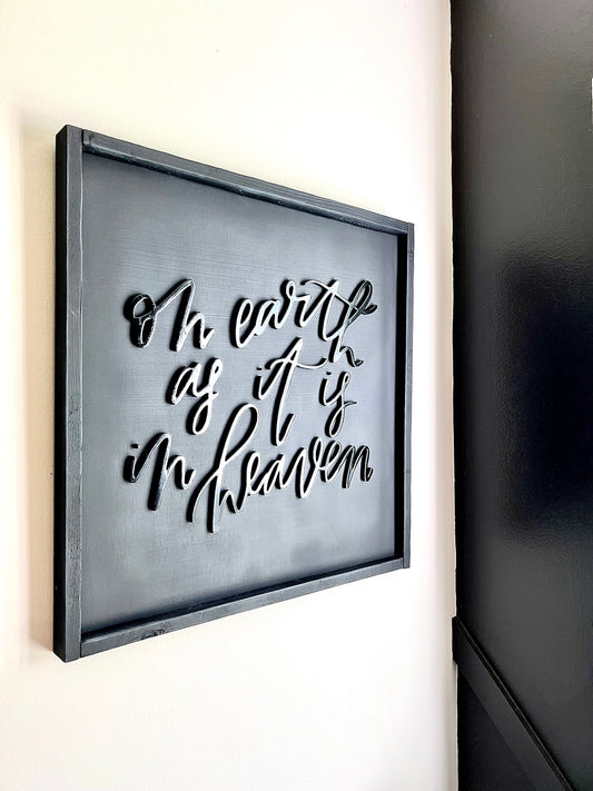 handcut 'on earth as it is in heaven' sign