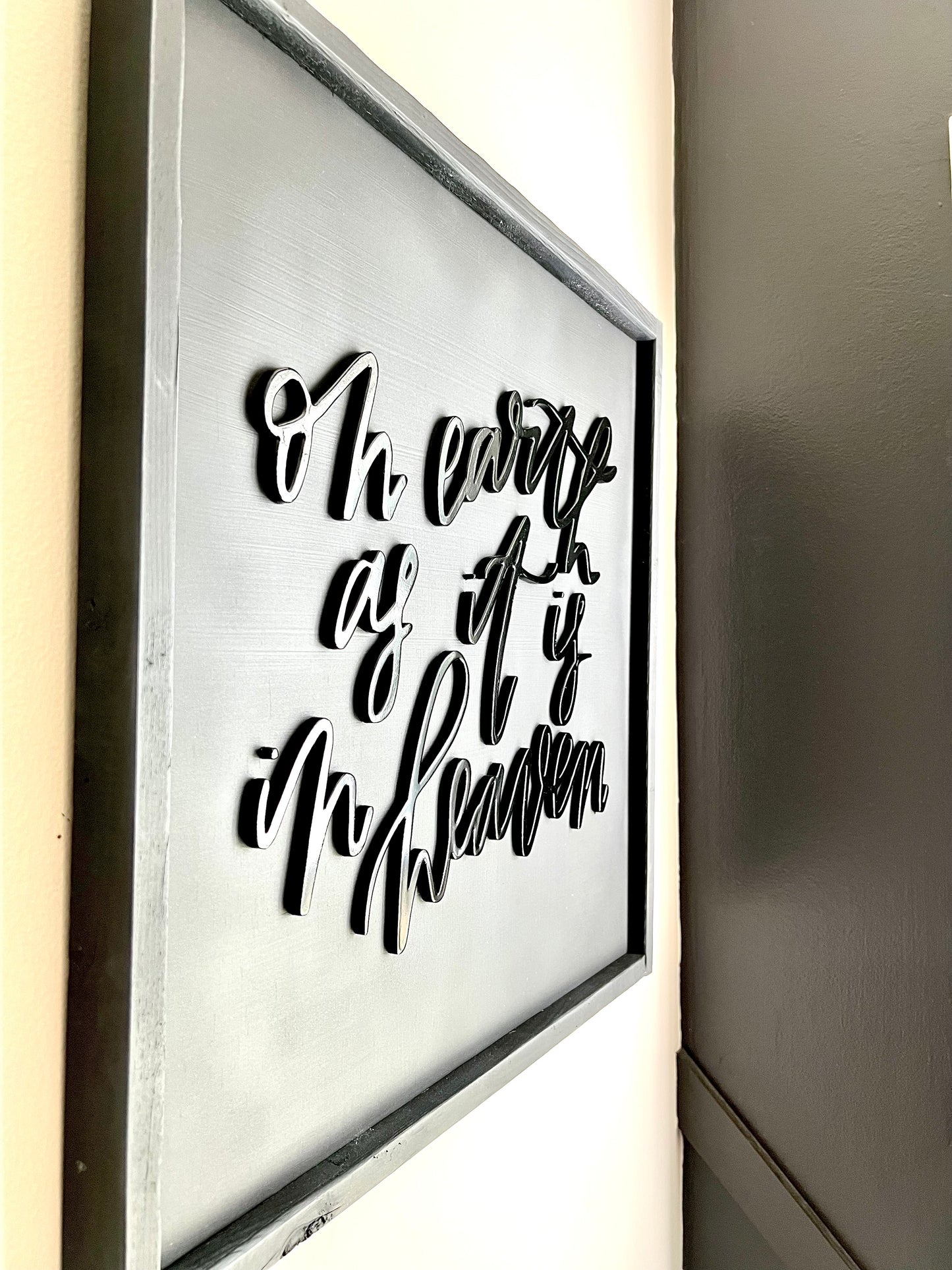 handcut 'on earth as it is in heaven' sign